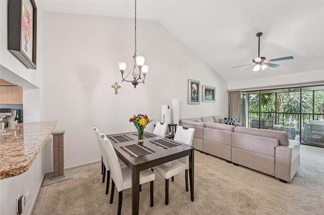 4735 Winslow Beacon Unit 14, Sarasota, FL 34235 - dining space featuring light carpet, a chandelier, high vaulted ceiling, and ceiling fan