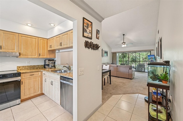 4735 Winslow Beacon Unit 14, Sarasota, FL 34235 - kitchen featuring stainless steel appliances, light brown cabinets, under cabinet range hood, light tile patterned floors, and lofted ceiling