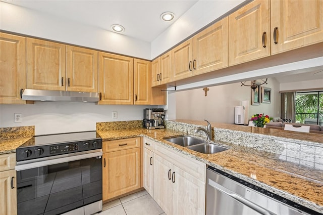 4735 Winslow Beacon Unit 14, Sarasota, FL 34235 - kitchen featuring range with electric stovetop, under cabinet range hood, dishwasher, light tile patterned floors, and light stone countertops