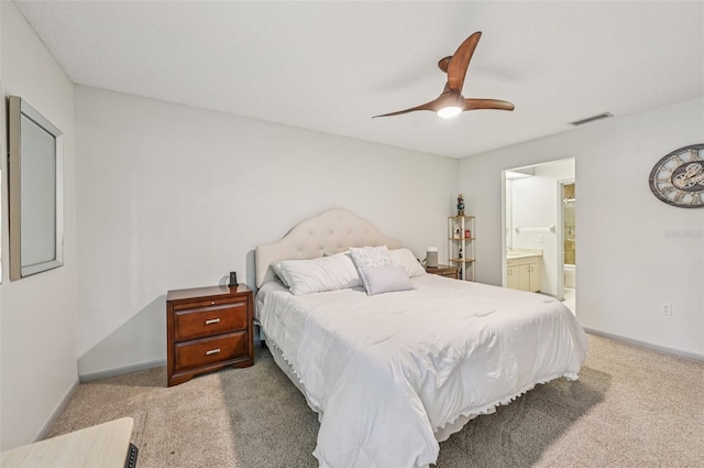 4735 Winslow Beacon Unit 14, Sarasota, FL 34235 - carpeted bedroom featuring ceiling fan and ensuite bath