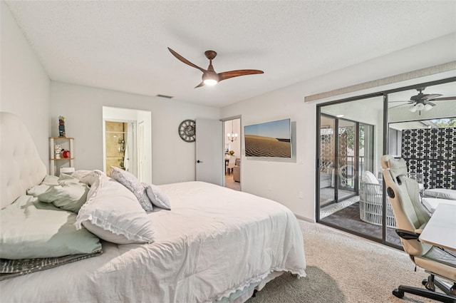 4735 Winslow Beacon Unit 14, Sarasota, FL 34235 - carpeted bedroom with access to exterior, a textured ceiling, and a ceiling fan