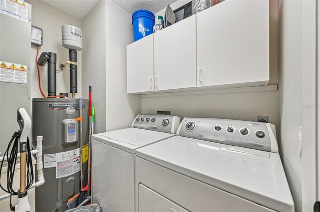 4735 Winslow Beacon Unit 14, Sarasota, FL 34235 - laundry room with water heater, washing machine and dryer, cabinet space, a textured ceiling, and heating unit