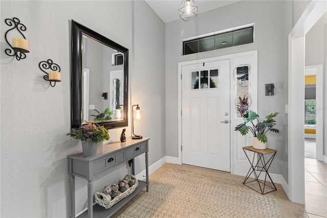 12004 Legacy Bright St, Riverview, FL 33578 - foyer featuring light tile patterned floors and baseboards
