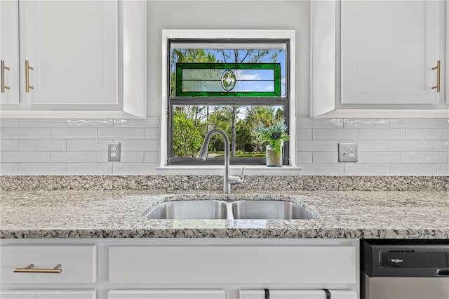 12004 Legacy Bright St, Riverview, FL 33578 - kitchen featuring white cabinetry, dishwasher, decorative backsplash, and light stone countertops