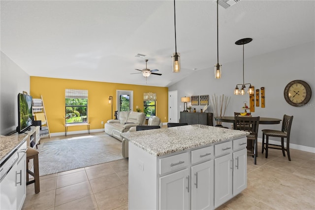 12004 Legacy Bright St, Riverview, FL 33578 - kitchen featuring a chandelier, hanging light fixtures, light tile patterned floors, a ceiling fan, and white cabinetry