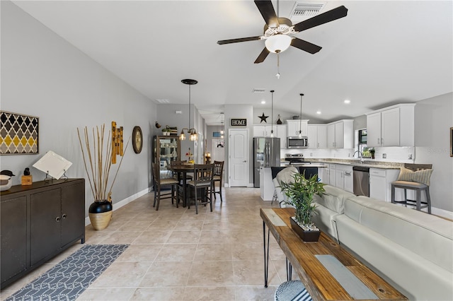 12004 Legacy Bright St, Riverview, FL 33578 - living room with ceiling fan, vaulted ceiling, and light tile patterned flooring