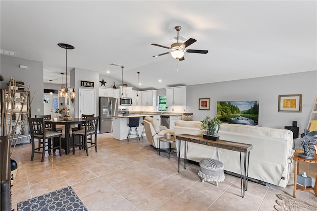 12004 Legacy Bright St, Riverview, FL 33578 - living area with lofted ceiling, ceiling fan, and light tile patterned flooring