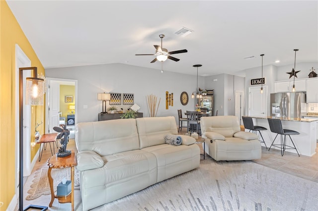 12004 Legacy Bright St, Riverview, FL 33578 - living room featuring ceiling fan and vaulted ceiling