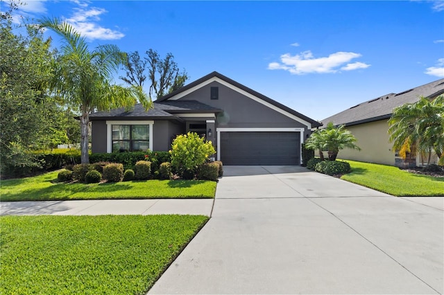 12004 Legacy Bright St, Riverview, FL 33578 - ranch-style house featuring an attached garage, stucco siding, driveway, and a front yard
