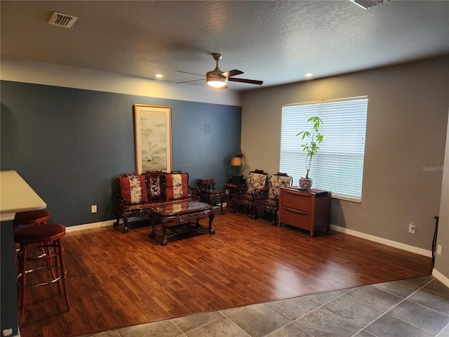 373 Intrepid Way, Indialantic, FL 32903 - sitting room featuring ceiling fan, tile patterned flooring, and baseboards