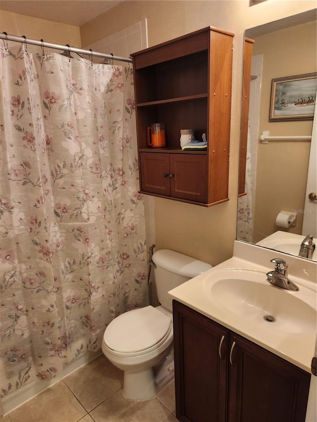 373 Intrepid Way, Indialantic, FL 32903 - bathroom with vanity, toilet, tile patterned flooring, and a shower with curtain
