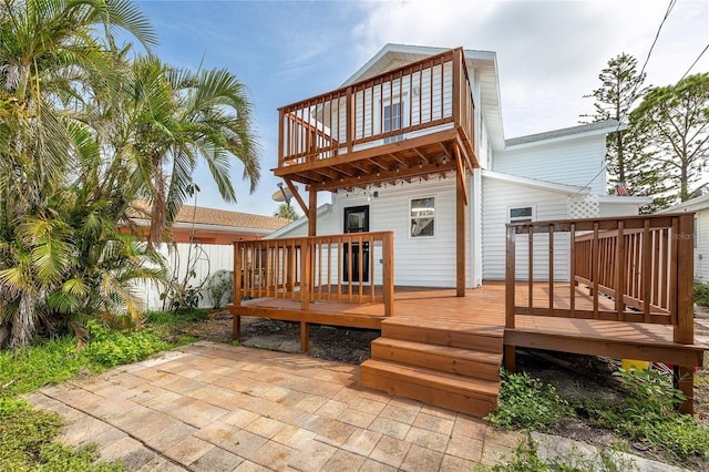 13148 3rd St E, Madeira Beach, FL 33708 - back of property featuring a patio, a balcony, and a wooden deck