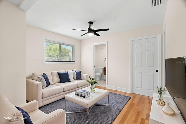 4414 W Oklahoma Ave, Tampa, FL 33616 - living room featuring ceiling fan and light wood-type flooring