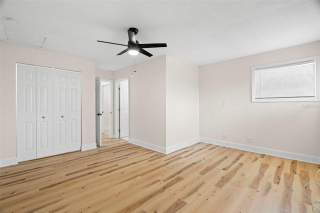 4414 W Oklahoma Ave, Tampa, FL 33616 - unfurnished bedroom with wood finished floors, a closet, and a ceiling fan