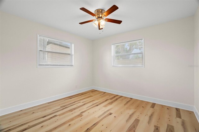 4414 W Oklahoma Ave, Tampa, FL 33616 - unfurnished room featuring plenty of natural light, light wood-type flooring, and ceiling fan