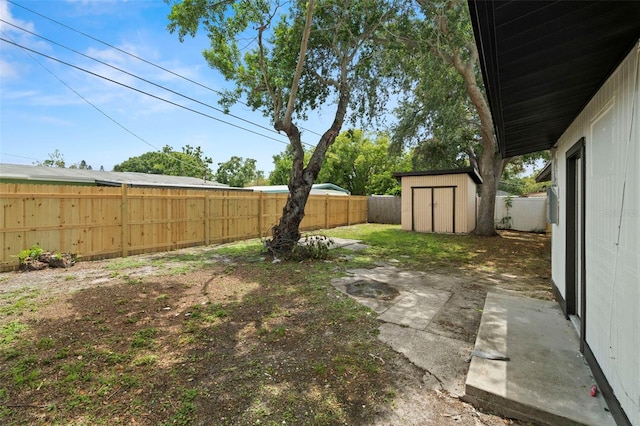4414 W Oklahoma Ave, Tampa, FL 33616 - fenced backyard featuring a shed and a patio area