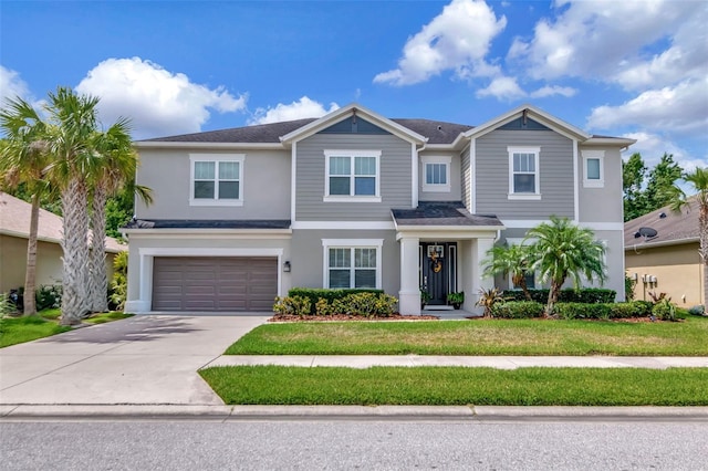 26972 Evergreen Chase Dr, Wesley Chapel, FL 33544 - view of front of property with driveway, stucco siding, an attached garage, and a front yard