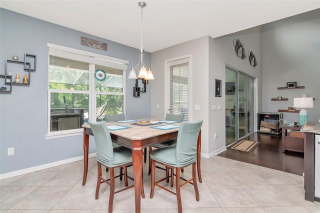 26972 Evergreen Chase Dr, Wesley Chapel, FL 33544 - dining space with baseboards and light tile patterned flooring