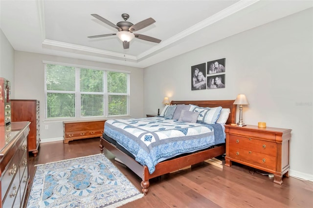 26972 Evergreen Chase Dr, Wesley Chapel, FL 33544 - bedroom featuring a raised ceiling, wood finished floors, crown molding, and a ceiling fan