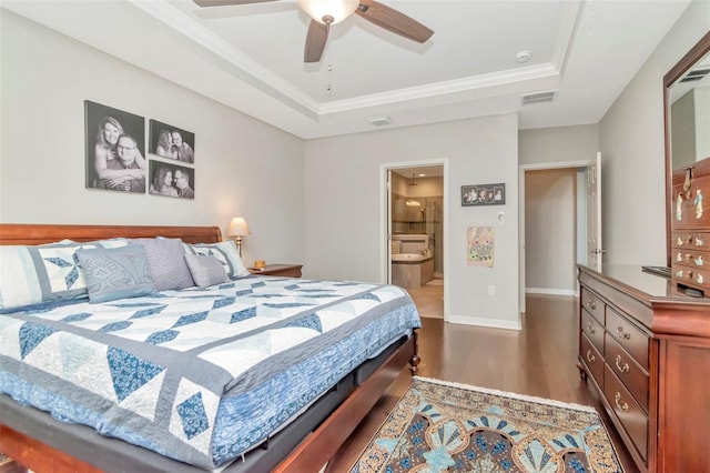 26972 Evergreen Chase Dr, Wesley Chapel, FL 33544 - bedroom with wood finished floors, a tray ceiling, ensuite bathroom, crown molding, and ceiling fan