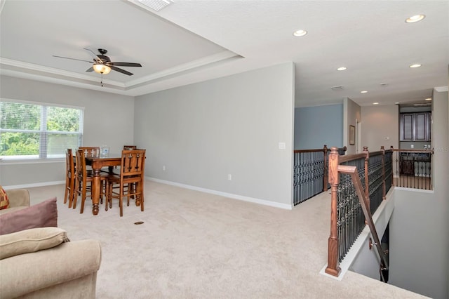 26972 Evergreen Chase Dr, Wesley Chapel, FL 33544 - dining area featuring light colored carpet, recessed lighting, ceiling fan, and a tray ceiling