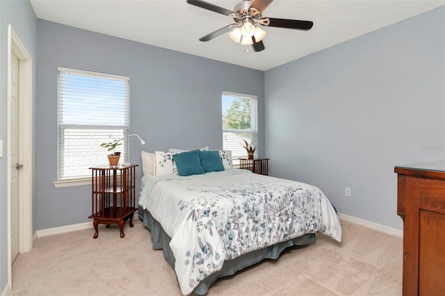 26972 Evergreen Chase Dr, Wesley Chapel, FL 33544 - bedroom featuring light colored carpet, multiple windows, and ceiling fan