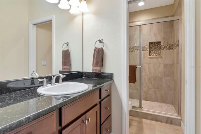 26972 Evergreen Chase Dr, Wesley Chapel, FL 33544 - bathroom featuring vanity, a shower stall, and tile patterned flooring