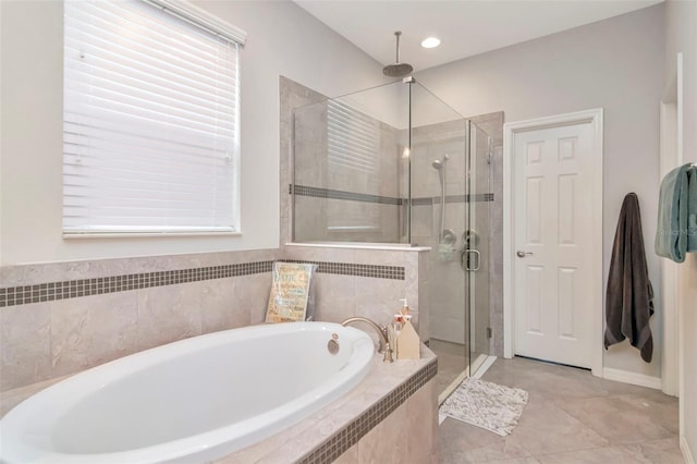 26972 Evergreen Chase Dr, Wesley Chapel, FL 33544 - bathroom featuring a shower stall, a bath, and tile patterned flooring