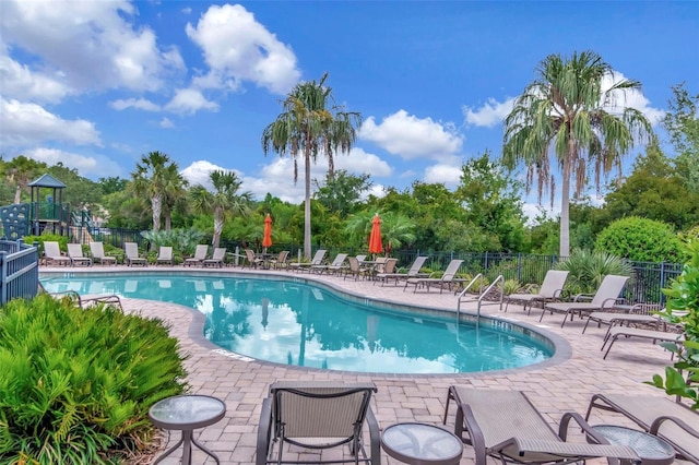 26972 Evergreen Chase Dr, Wesley Chapel, FL 33544 - community pool with a patio area and view of wooded area