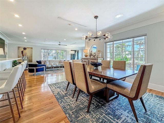 301 23rd Ave NE, Saint Petersburg, FL 33704 - dining area with light wood finished floors, recessed lighting, a chandelier, ornamental molding, and a ceiling fan