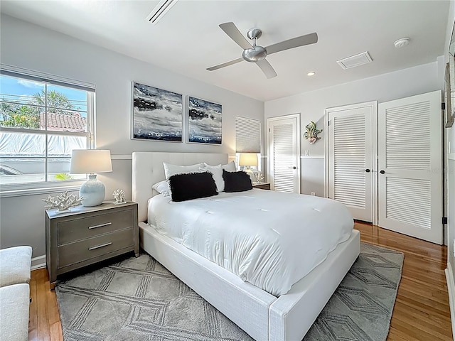 301 23rd Ave NE, Saint Petersburg, FL 33704 - bedroom featuring multiple closets, wood finished floors, ceiling fan, and recessed lighting