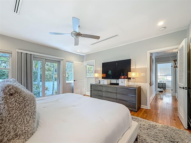 301 23rd Ave NE, Saint Petersburg, FL 33704 - bedroom featuring light wood finished floors, access to exterior, and ceiling fan