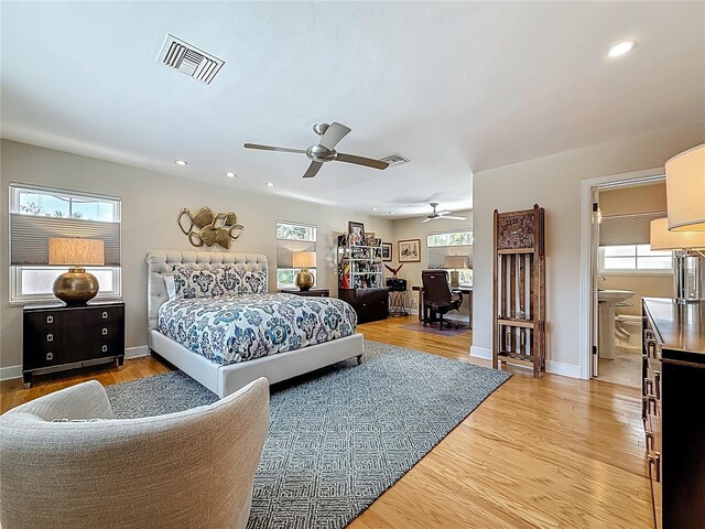 301 23rd Ave NE, Saint Petersburg, FL 33704 - bedroom with light wood finished floors, recessed lighting, ceiling fan, and an office area
