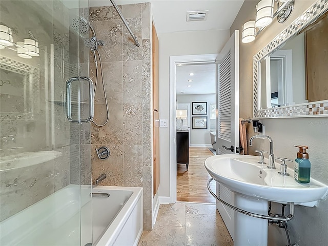 301 23rd Ave NE, Saint Petersburg, FL 33704 - bathroom with tub / shower combination and baseboards