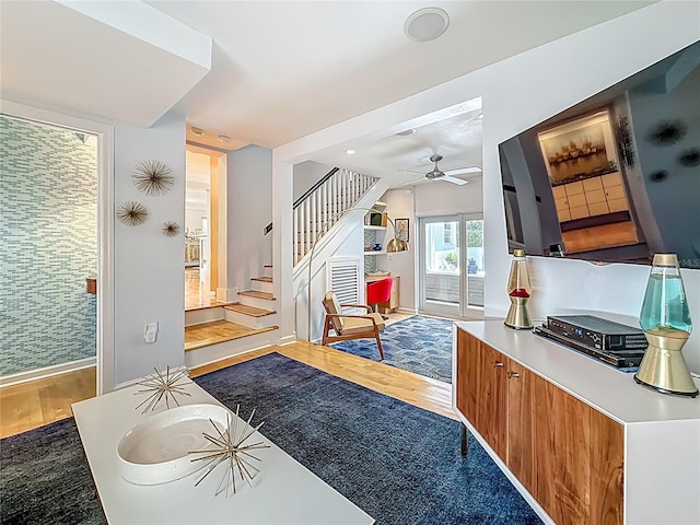 301 23rd Ave NE, Saint Petersburg, FL 33704 - living room featuring wood finished floors, ceiling fan, and stairs