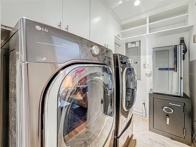 301 23rd Ave NE, Saint Petersburg, FL 33704 - laundry area with separate washer and dryer and cabinet space