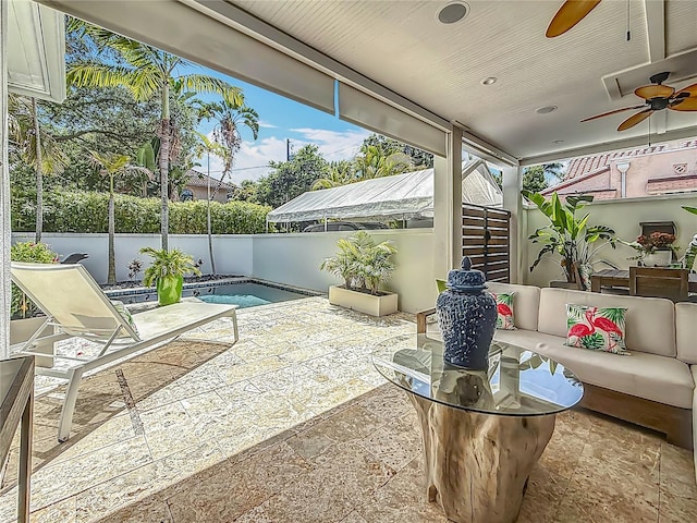 301 23rd Ave NE, Saint Petersburg, FL 33704 - fenced backyard with outdoor lounge area, ceiling fan, and a patio