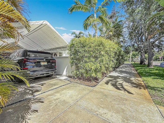 301 23rd Ave NE, Saint Petersburg, FL 33704 - view of home's exterior with a carport and driveway