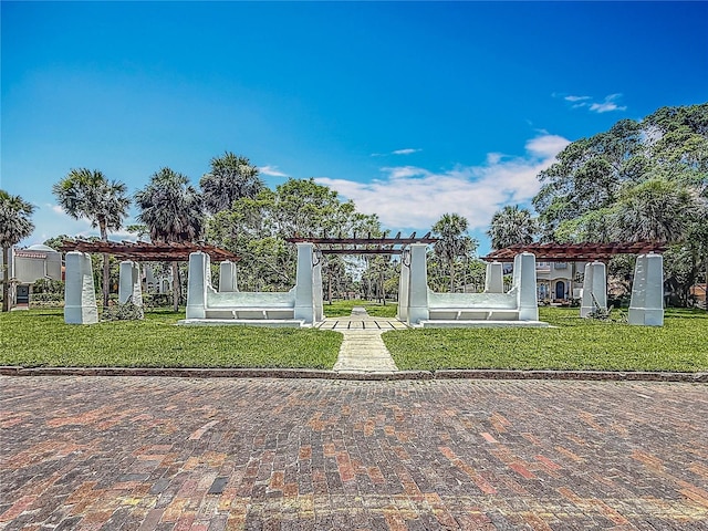301 23rd Ave NE, Saint Petersburg, FL 33704 - view of home's community with a pergola and a lawn