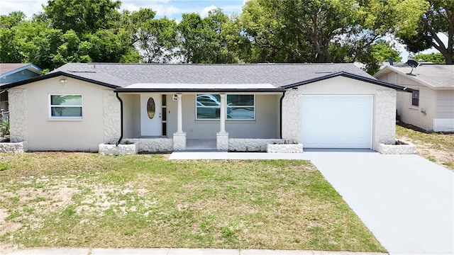 4638 Durney St, New Port Richey, FL 34652 - ranch-style home with stone siding, a garage, driveway, and a front yard