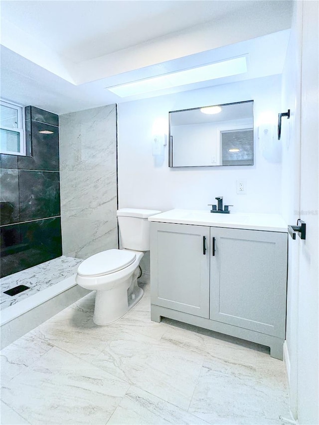 4638 Durney St, New Port Richey, FL 34652 - bathroom with vanity, a tile shower, and marble look tiles