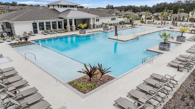36414 Well Hill Way, Zephyrhills, FL 33541 - community pool featuring a residential view and a patio