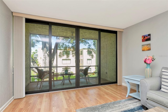 14130 Rosemary Ln Unit 3202, Largo, FL 33774 - doorway to outside with wood finished floors, healthy amount of natural light, floor to ceiling windows, and french doors