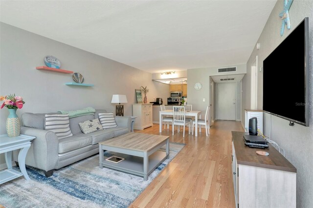14130 Rosemary Ln Unit 3202, Largo, FL 33774 - living area with light wood-style floors