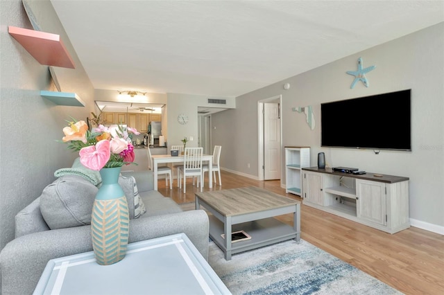 14130 Rosemary Ln Unit 3202, Largo, FL 33774 - living room featuring light wood finished floors and baseboards