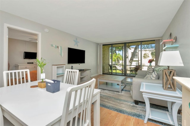 14130 Rosemary Ln Unit 3202, Largo, FL 33774 - dining space featuring light wood-style floors and baseboards