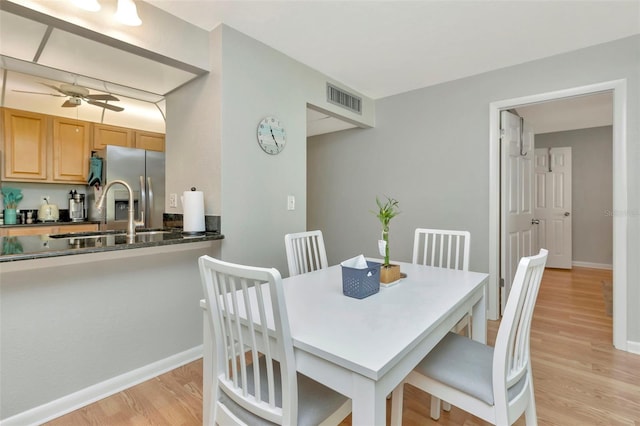 14130 Rosemary Ln Unit 3202, Largo, FL 33774 - dining room featuring light wood-style floors and a ceiling fan