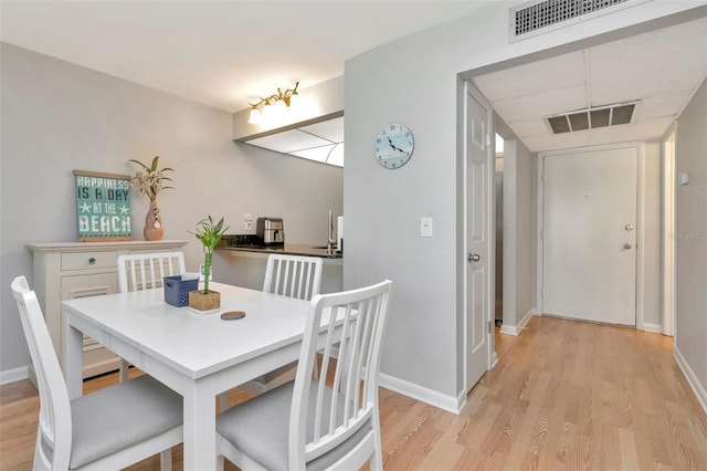 14130 Rosemary Ln Unit 3202, Largo, FL 33774 - dining area with light wood-style floors and baseboards