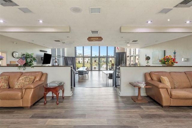 14130 Rosemary Ln Unit 3202, Largo, FL 33774 - living area with a ceiling fan, expansive windows, wood finished floors, and recessed lighting
