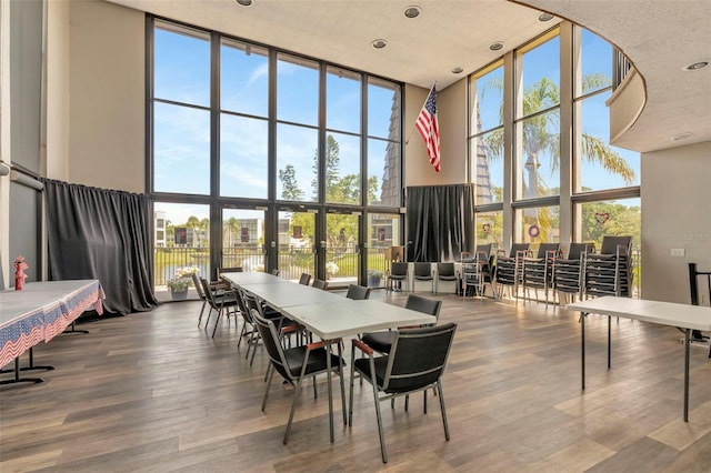 14130 Rosemary Ln Unit 3202, Largo, FL 33774 - dining space with a high ceiling, expansive windows, wood finished floors, and recessed lighting